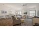 Living room featuring hardwood floors, dining area and ample natural light and comfortable seating at 6248 Siverson Ter, The Villages, FL 32163