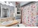 Bathroom featuring a sink, toilet, and shower/tub with beach-themed decor at 638 Mount Homer Rd # 3-C, Eustis, FL 32726