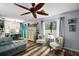 Bright living room with wood floors and beach-themed decor, adjacent to the kitchen at 638 Mount Homer Rd # 3-C, Eustis, FL 32726