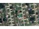 An aerial view of a neighborhood showcases lush greenery and beautiful homes in a well-maintained community at 685 Reindeer Dr, Kissimmee, FL 34759