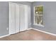 Bedroom showcasing neutral wall colors and a window, complete with a spacious closet at 685 Reindeer Dr, Kissimmee, FL 34759