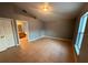 Neutral bedroom features large window with closet, and adjoining bathroom at 685 Reindeer Dr, Kissimmee, FL 34759