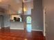 Bright living room with terra cotta tile flooring, open to the kitchen with stainless steel appliances at 685 Reindeer Dr, Kissimmee, FL 34759