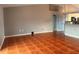 View of the living room highlighting the terra cotta tile flooring, and neutral wall color at 685 Reindeer Dr, Kissimmee, FL 34759