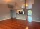 Spacious living room featuring terra cotta tile floors, vaulted ceilings, and an open view to the kitchen at 685 Reindeer Dr, Kissimmee, FL 34759