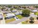 Charming single-story home in a peaceful neighborhood with well-maintained lawns and mature trees at 705 Prado Dr, The Villages, FL 32159