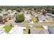 Aerial view of a well-maintained home in a serene neighborhood, offering a peaceful living environment at 705 Prado Dr, The Villages, FL 32159