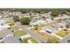 Aerial view of a charming home situated in a peaceful neighborhood with well-manicured lawns at 705 Prado Dr, The Villages, FL 32159