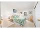 Charming bedroom with a comfortable bed, window, and dresser at 705 Prado Dr, The Villages, FL 32159