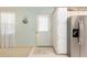 Bright kitchen features stainless steel appliances, white cabinetry, and ample counter space at 705 Prado Dr, The Villages, FL 32159