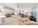 Spacious living room filled with natural light, inviting neutral tones and comfortable furnishings at 705 Prado Dr, The Villages, FL 32159