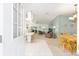 Open-concept living space boasts a light and airy ambiance with eat in kitchen and comfortable seating areas at 705 Prado Dr, The Villages, FL 32159