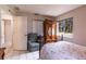 Bedroom with chair, wardrobe and natural light, offering relaxation at 7938 Jacksons River Rd, Leesburg, FL 34788