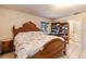 Bedroom featuring an ornate bed frame and bright light from the large window at 7938 Jacksons River Rd, Leesburg, FL 34788