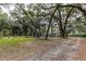 Expansive yard with mature trees, offering privacy and a natural setting at 7938 Jacksons River Rd, Leesburg, FL 34788