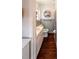 Nicely appointed bathroom showcases beadboard paneling, decorative shelving and modern fixtures at 802 Haselton St, Eustis, FL 32726