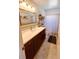 Clean bathroom featuring a vanity, decorative mirror and shower at 802 Haselton St, Eustis, FL 32726