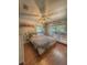 Relaxing bedroom featuring a bed, dresser, and plenty of natural light from windows, offering a serene atmosphere at 802 Haselton St, Eustis, FL 32726