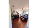 Cozy bedroom featuring hardwood floors, a ceiling fan, and a playful hammock chair at 802 Haselton St, Eustis, FL 32726