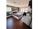 Bedroom with hardwood floors, abundant natural light, and modern decor at 802 Haselton St, Eustis, FL 32726