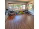 Bright bonus room featuring lots of natural light, wood floors, and ample space for play and work at 802 Haselton St, Eustis, FL 32726