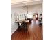 Open-concept dining area showcasing wood floors, and natural light at 802 Haselton St, Eustis, FL 32726