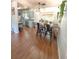 Bright dining area with hardwood floors, stylish bar seating, and modern pendant lighting at 802 Haselton St, Eustis, FL 32726