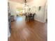 Dining room with hardwood floors and bar seating that connects to the kitchen at 802 Haselton St, Eustis, FL 32726