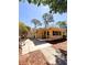 Backyard exterior view featuring an enclosed porch area and mature trees at 802 Haselton St, Eustis, FL 32726