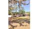 Inviting single-story home with a lush, green lawn, shaded by mature trees at 802 Haselton St, Eustis, FL 32726