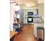 Well-lit kitchen with wood floors and stainless steel appliances at 802 Haselton St, Eustis, FL 32726
