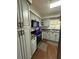 Charming kitchen with gray cabinets, modern appliances, and wood-look flooring at 802 Haselton St, Eustis, FL 32726