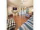 Comfortable living room featuring hardwood floors and a view into the kitchen at 802 Haselton St, Eustis, FL 32726