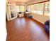 Bright office space with wood floors and large windows overlooking the backyard at 802 Haselton St, Eustis, FL 32726