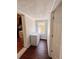 Well-lit pantry area features a window, sleek white freezer, and hardwood floors at 802 Haselton St, Eustis, FL 32726