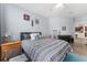 Bedroom with neutral walls and patterned bedding at 8256 Maritime Flag St # 103, Windermere, FL 34786