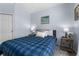 This bedroom is cozy and features natural light, cool paint and wood bedside tables at 8256 Maritime Flag St # 103, Windermere, FL 34786