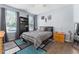 Light-filled bedroom with modern decor and wood flooring at 8256 Maritime Flag St # 103, Windermere, FL 34786
