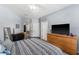 The main bedroom features wood floors, and multiple windows at 8256 Maritime Flag St # 103, Windermere, FL 34786