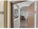 Inviting condo entryway with a warm color palette, modern flooring, and a view into the living area at 8256 Maritime Flag St # 103, Windermere, FL 34786