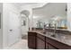 Bright kitchen featuring an open layout with views into other living spaces and double sinks at 8256 Maritime Flag St # 103, Windermere, FL 34786