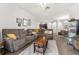 Spacious living room featuring an open floor plan to the dining area at 8256 Maritime Flag St # 103, Windermere, FL 34786