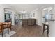 Open living area with wood floors, ceiling fan, neutral color, and access to a bedroom and outdoor seating at 8256 Maritime Flag St # 103, Windermere, FL 34786