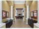 Elegant lobby area with tile flooring, decorative columns, and comfortable seating at 8256 Maritime Flag St # 103, Windermere, FL 34786