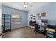 This home office is filled with personal effects and a neutral color scheme at 8256 Maritime Flag St # 103, Windermere, FL 34786