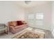 Bonus room featuring carpeted floors and a comfortable seating area with a rug for relaxation at 853 Laurel View Way, Groveland, FL 34736
