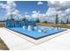 Outdoor fitness park with modern exercise equipment and blue flooring at 853 Laurel View Way, Groveland, FL 34736
