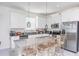 Modern kitchen featuring stainless steel appliances, a breakfast bar, and plenty of counter space at 853 Laurel View Way, Groveland, FL 34736
