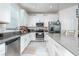 Spacious kitchen with stainless steel appliances and a large island, perfect for entertaining at 853 Laurel View Way, Groveland, FL 34736