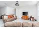 Cozy living room with neutral walls, tile floors, modern ceiling fan and comfortable seating at 853 Laurel View Way, Groveland, FL 34736